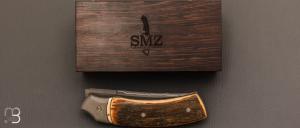 Couteau  " custom " liner lock ivoire de mammouth et lame sandwich de SMZ Flammes de forge