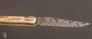 Couteau Laguiole en Aubrac modèle Origine Tour Eiffel N°61 - Croûte d'ivoire de mammouth et Damas Balbach